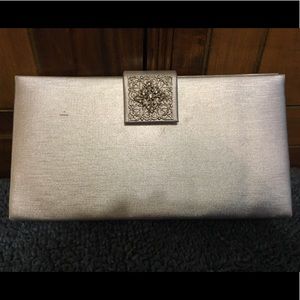 Silver satin clutch w/silver tone accent clasp